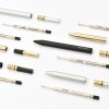 Precision tool assembly with gold, black, and silver components for custom creative projects.