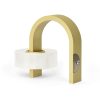Golden tape dispenser with white adhesive tape, modern and stylish kitchen or office accessory. Perfect for wrapping, packaging, or craft projects; combines functionality with contemporary design.