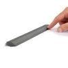 Slate gray magnetic cooking spoon holder with measurement markings in person, designed to keep spoons easily accessible and organized in the kitchen.