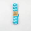 Blue and white zigzag patterned 3M ribbon for wrapping, crafting, and DIY projects. Perfect for adding stylish accents to gift wrapping, scrapbooking, and decorative crafts.