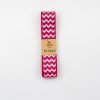 Pink chevron patterned ribbon from The Wraperie, perfect for gift wrapping and craft projects.