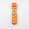 Bright orange chevron-patterned 3M ribbon for crafting, sewing, and decoration, with eco-friendly Deva label. Ideal for DIY projects, gift wrapping, and embellishments, adding vibrant color and texture.