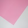 Vibrant pink wrapping paper on a white background, showcasing premium quality and smooth texture, perfect for gift wrapping and special occasions.