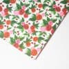 Rose and ladybug patterned wrapping paper, vibrant floral design, perfect for gift wrapping, celebrations, and special occasions, available at The Wraperie.