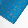 Vibrant blue wrapping paper with elegant gold foil coffee bean pattern, perfect for gift wrapping or special occasions, showcasing unique and stylish design from The Wraperie.