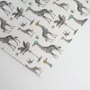 Giraffe-patterned wrapping paper with palm trees and birds, decorative gift wrap, stylish and unique design for special occasions, the wraperie.