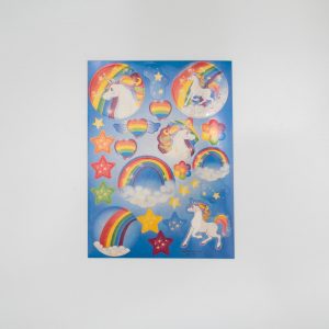 Colorful unicorn-themed sticker sheet with rainbows, stars, clouds, and hearts for kids' crafts and decor.