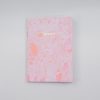 Pink marble notebook with "NOTES" embossed in gold for stylish note-taking and journaling.