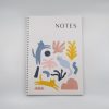 Colorful illustrated notebook cover with playful cat and plant designs, labeled "NOTES," perfect for creative note-taking or journaling.