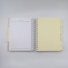 Spiral-bound planner with yellow dividers and labeled tabs for recipes, decoration, and more, designed for organizing daily tasks and creative ideas.