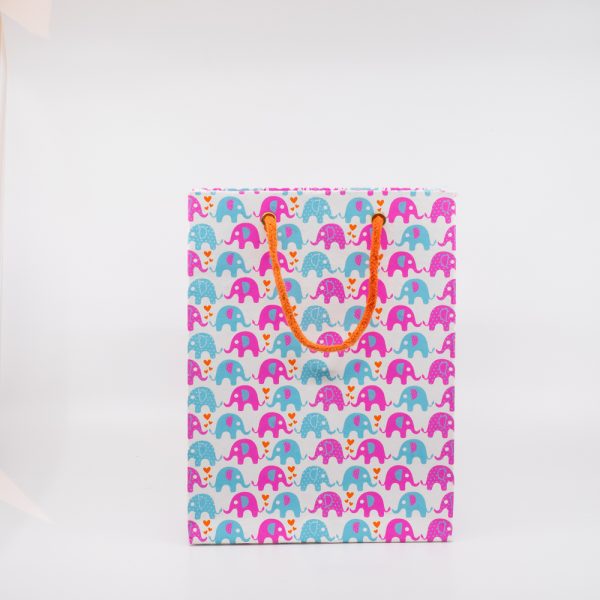 Colorful elephant patterned gift bag with orange handle, perfect for party favors and celebrations.