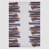 Paintbrushes and makeup brushes flat on white background for professional makeup application and cosmetics artistry.