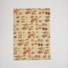 Colorful seashell pattern printed on a fabric wrap from The Wraperie. Perfect for gift wrapping, decor, or crafting projects with ocean-inspired themes. High-quality, eco-friendly wrapping paper.