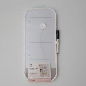 White magnetic weekly planner dry erase board for kitchen or office organization.