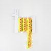 Colorful craft ribbon on a llama-shaped wall hook, perfect for DIY projects and gift wrapping at The Wraperie. Bright, decorative, and vibrant design for creative home decor.