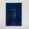 Elegant blue laboratory-themed notebook with yellow scientific equipment illustration, ideal for science professionals and students. Perfect for notes and experiments at The Wraperie.
