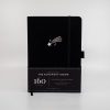 Black notebook with shooting star design, ideal for journaling, note-taking, or creative writing.