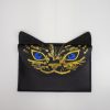 Vegan leather cat face wristlet with gold and blue design, ideal as a stylish accessory or small purse, perfect for cat lovers and fashion enthusiasts.