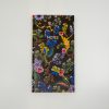 Vibrant floral patterned notebook with "NOTES" text on the cover, perfect for journaling, sketching, or note-taking, featuring colorful botanical design on a black background.