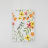 Vibrant floral patterned food wrapper featuring colorful spring blossoms, ideal for eco-friendly takeout, catering, and wrap solutions at The Wraperie.