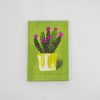Vibrant cactus artwork with purple flowers in a yellow pot on a lime green background, modern wall decor piece.