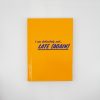 Bright yellow notebook with humorous quote, "I am definitely not... LATE AGAIN," on the cover, perfect for stress relief and fun journaling.