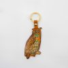 Colorful owl-shaped leather keychain with gold hardware and vibrant details, perfect as a stylish accessory from The Wraperie.