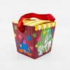 Colorful circus-themed popcorn gift box with a red ribbon handle, featuring a unicorn and tiger illustration, ideal for parties and celebrations.