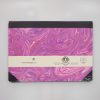 Vibrant pink and purple marbled packaging designed for The Wraperie, showcasing elegant, handcrafted wrapping paper with artistic patterns, suitable for gift wrapping and special occasions.
