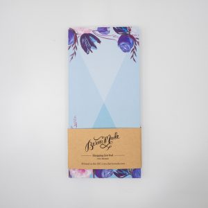 Vegan-friendly shopping list pad with floral blue and pink design, perfect for meal planning and grocery lists.