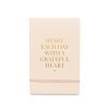 Inspirational quote card with the message "Start Each Day with a Grateful Heart" in gold lettering on a soft pink background, perfect for daily motivation and positivity.