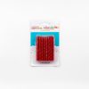 Colorful birthday candles in red with gold glitter, perfect for celebrating special occasions, birthday cake decor, and party events at The Wraperie.