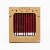 Red birthday candles in eco-friendly kraft paper box, perfect for celebration and cake decoration.
