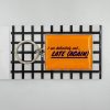 Keychain with a humorous "I am definitely not... LATE (AGAIN)" message, perfect for foodies and casual fashion accessories, displayed on a black and white grid background at The Wraperie.