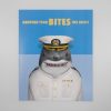 Shark dressed as a military captain with a humorous poster background at The Wraperie, showcasing creative food presentation and branding.
