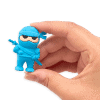 Ninja-themed small toy figure, vibrant blue color, cartoon design, with sunglasses and sword, held between fingers on a plain background.