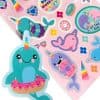 Colorful unicorn and donut stickers with playful designs, perfect for decorating or crafting, featured on The Wraperie's fun and whimsical sticker sheet.
