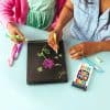 Vibrant chalkboard drawing of flowers and hearts at The Wraperie on a creative chalkboard, showcasing fun and colorful chalk art supplies perfect for kids' art projects and creative expression.