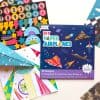 Colorful sticker sheets and DIY paper airplane kits featuring space and rocket designs for kids. Suitable for craft projects, educational activities, and fun creative play.