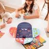 Colorful kids playing with educational and craft activity kits at The Wraperie, a creative space for children’s arts and crafts workshops and activities.
