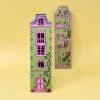 Pink and green decorative house-shaped paper wand and dollhouse cutouts on yellow background, whimsical home decor and craft accessories from The Wraperie, perfect for children’s play or DIY projects.