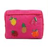 Colorful beaded fruit-themed clutch bag with strawberries, pineapples, cherries, and a pumpkin embroidery on pink fabric, perfect for summer accessories.