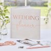 Elegant wedding planner notebook with blush pink lettering, perfect for organizing wedding details. Ideal for brides and wedding planners to keep track of plans, vendor contacts, and schedules.