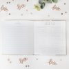 Notes section in a wedding planning notebook with checklists and inspiring decor, surrounded by love-themed embellishments and greenery, perfect for organizing wedding details and memories.