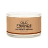 A candle with a humorous label referencing old friends and nostalgia.