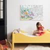 Colorful Dubai-themed coloring poster hanging on white wall in a child's bedroom.