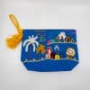 Vibrant embroidered beach scene pouch with palm trees and colorful huts, featuring a yellow tassel zipper pull. Perfect for summer accessories, gift packaging, or travel organization.