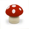 Red mushroom-shaped wooden decor, perfect for kitchen or fairy garden embellishments, featuring a bright red cap with white spots and a cream stem for a charming, whimsical touch.