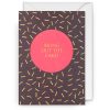 Bright birthday card with "Bring Out The Cake!" message, featuring vibrant pink and black confetti design, perfect for celebrating special occasions and cake-themed celebrations.
