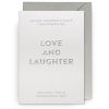 Elegant white greeting card with embossed silver text that reads "Love and Laughter" and inspiring message, perfect for celebrating special occasions and spreading positive vibes.